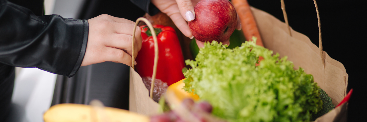 Grocery bags with healthy foods. 