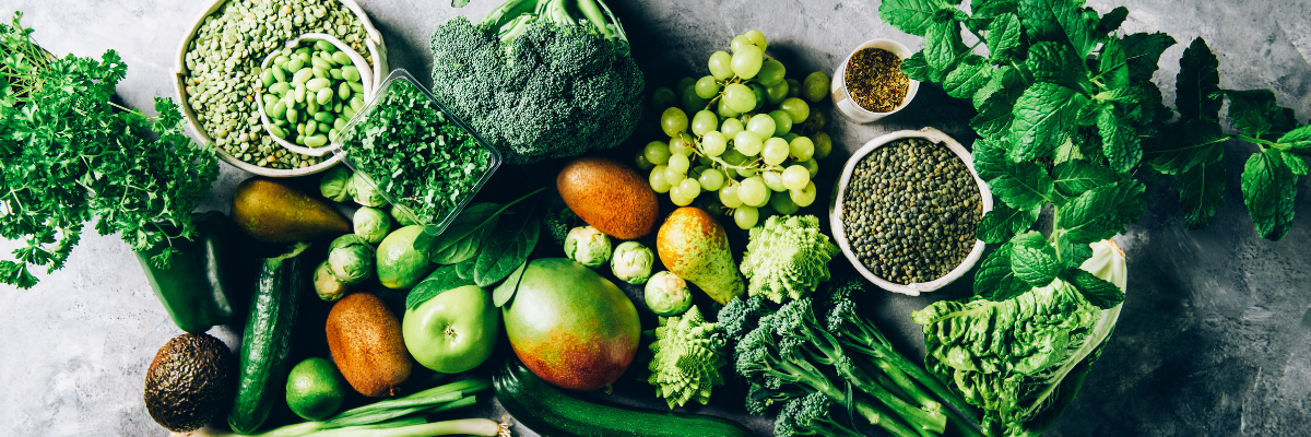 An array of healthy, fiber-rich foods on a slate surface.