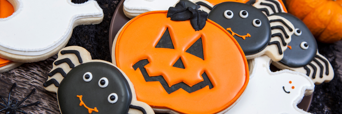 Many iced cookies decorated for Halloween.