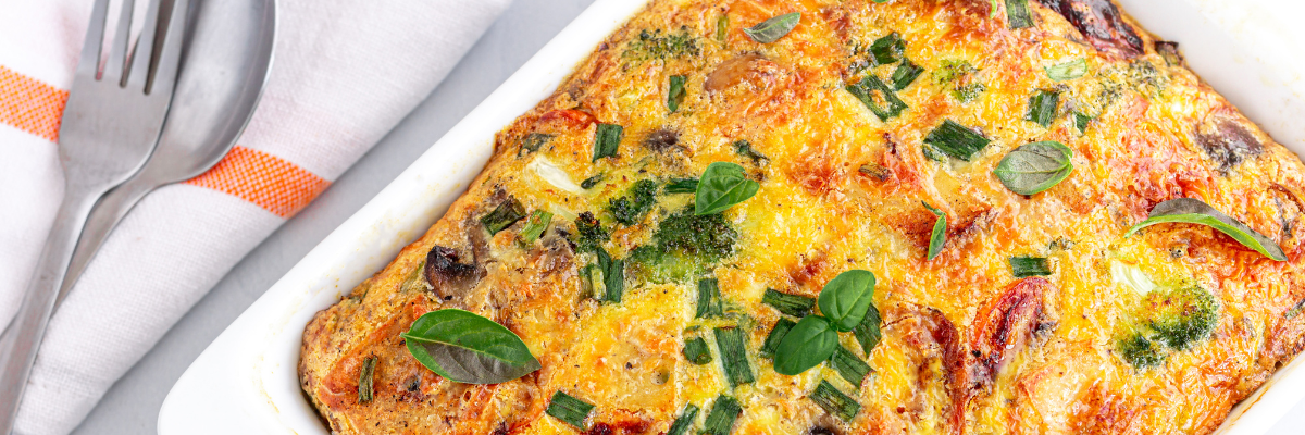 Make-Ahead Veggie Breakfast Casserole with a fork and knife nearby.