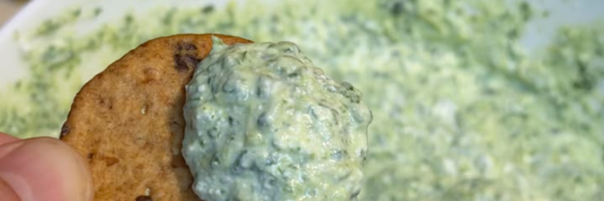 Arugula Pesto & Cottage Cheese Dip on a cracker