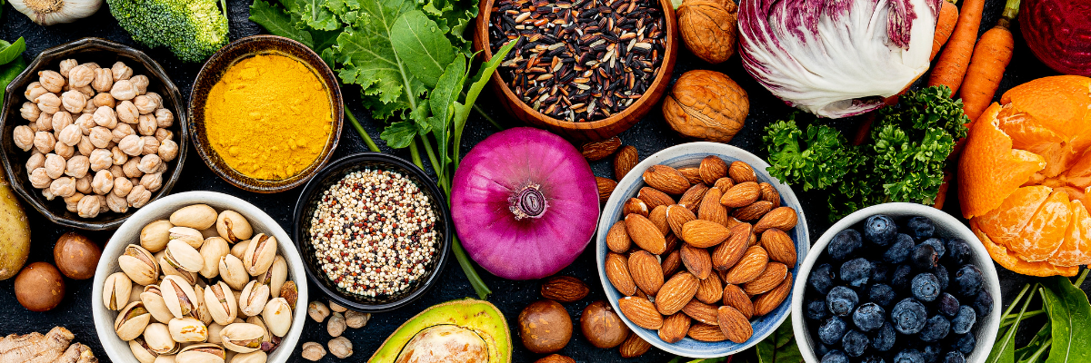 A variety of healthy foods like nuts, seeds, grains, and fresh produce. 