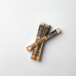 Three sticks of Just Be Better Allulose on a light gray background