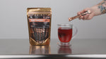 Video of just better allulose being poured into a cup of tea and dissolving